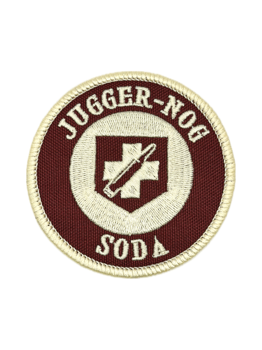 Round patch with 'Jugger-Nog Soda' text and logo on a white background