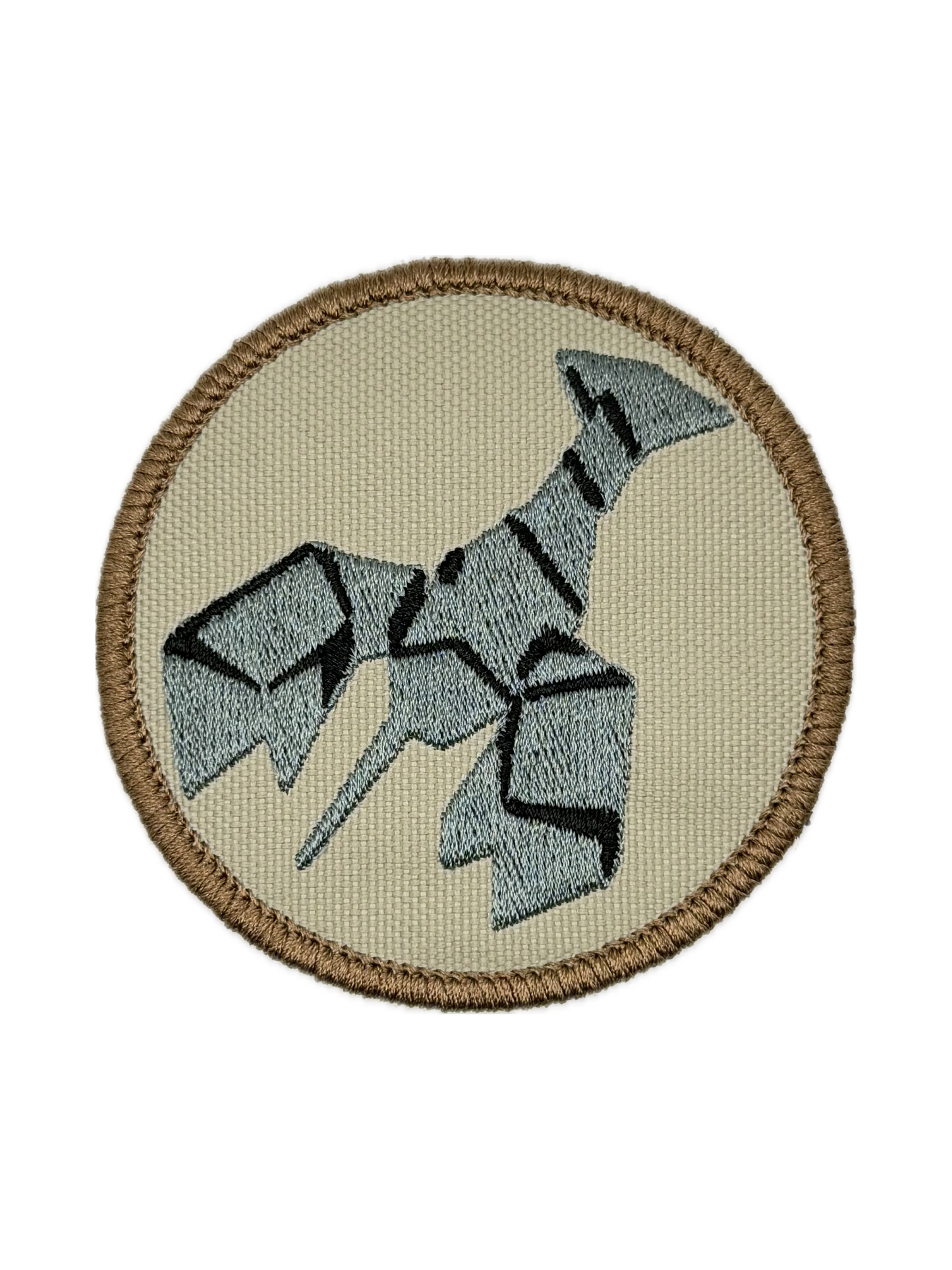 Circular patch with a stylized burnt lobster design on a beige background