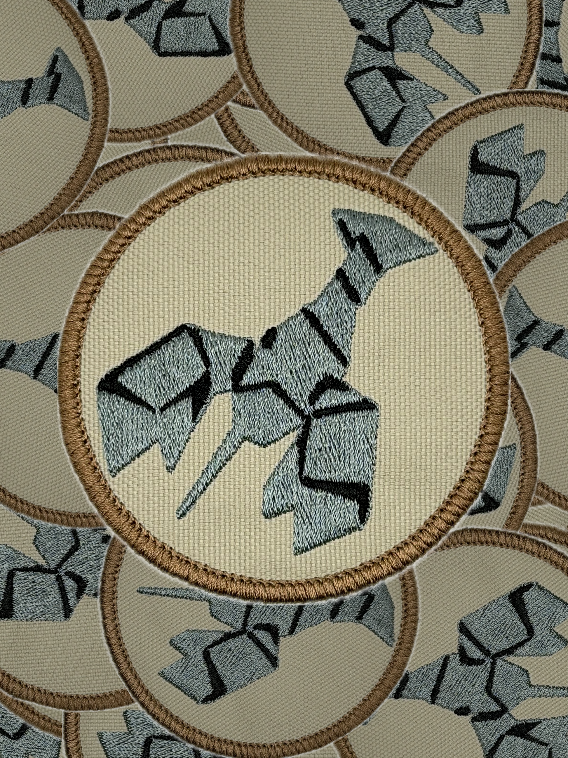 Embroidered patch of a burnt lobster on a beige background with circular border