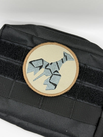 Black tactical pouch with a round patch featuring a geometric burnt lobster design on a white background