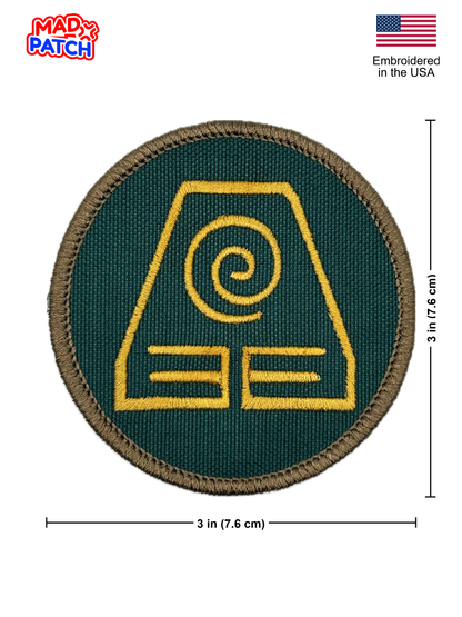 Green patch with yellow earthbending design and Mad Patch branding, embroidered in the USA.
