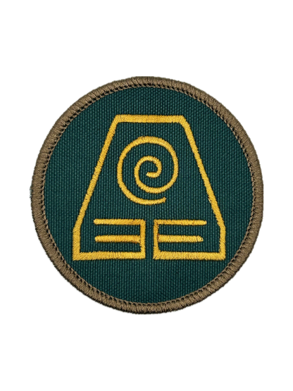 Circular patch with an earthbending yellow symbol on a green background