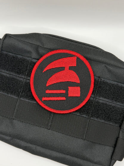 Black pouch with a red emblem on a white background. Hardcore ironman logo