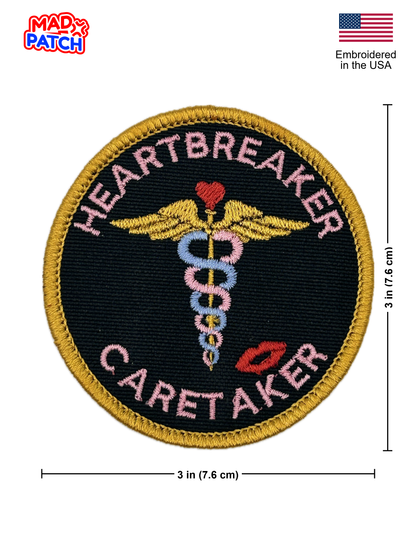 Embroidered patch with 'Heartbreaker Caretaker' design and Mad Patch branding.