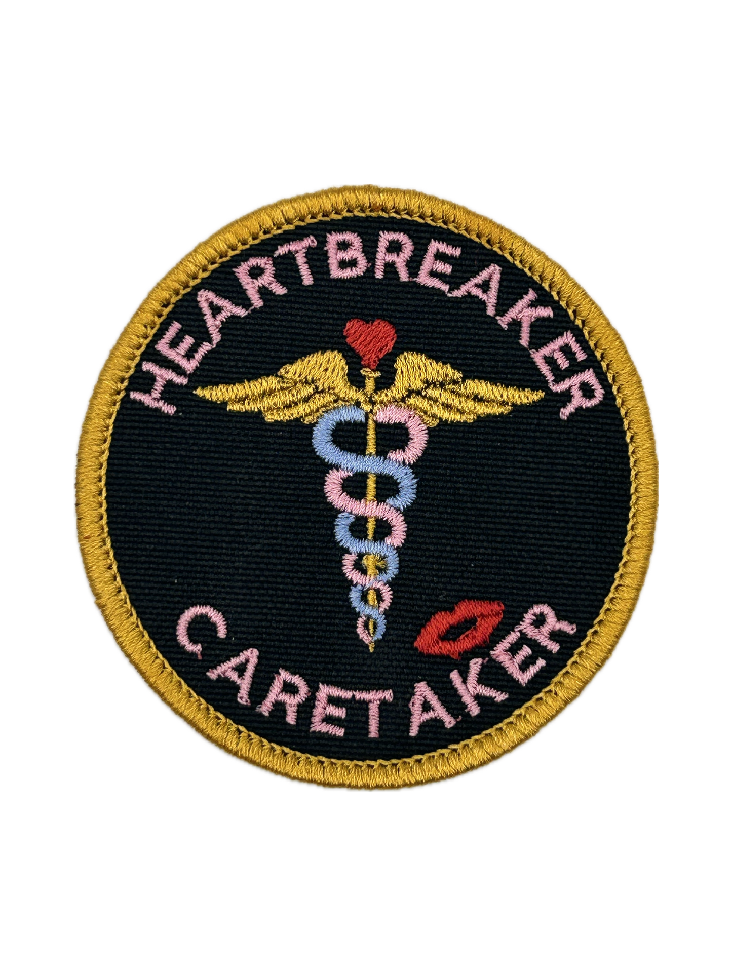 Patch with 'Heartbreaker Caretaker' text and medical symbol on a black background