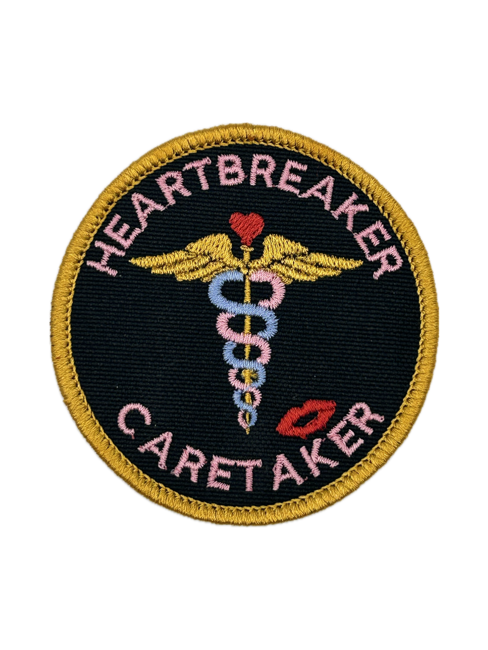 Patch with 'Heartbreaker Caretaker' text and medical symbol on a black background