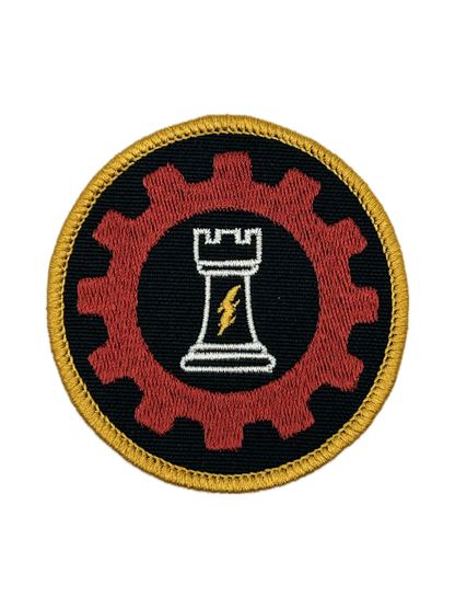 Circular patch with a red gear, white chess piece, and yellow border for ordo reductor on a black background