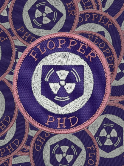 Collection of 'FLOPPER' patches with a radiation symbol on a blue background