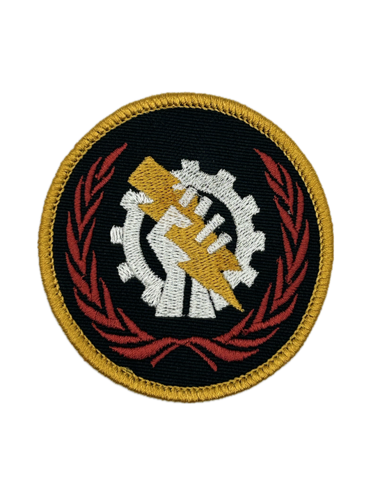 Circular Skitarii patch with a gear and hand design on a black background