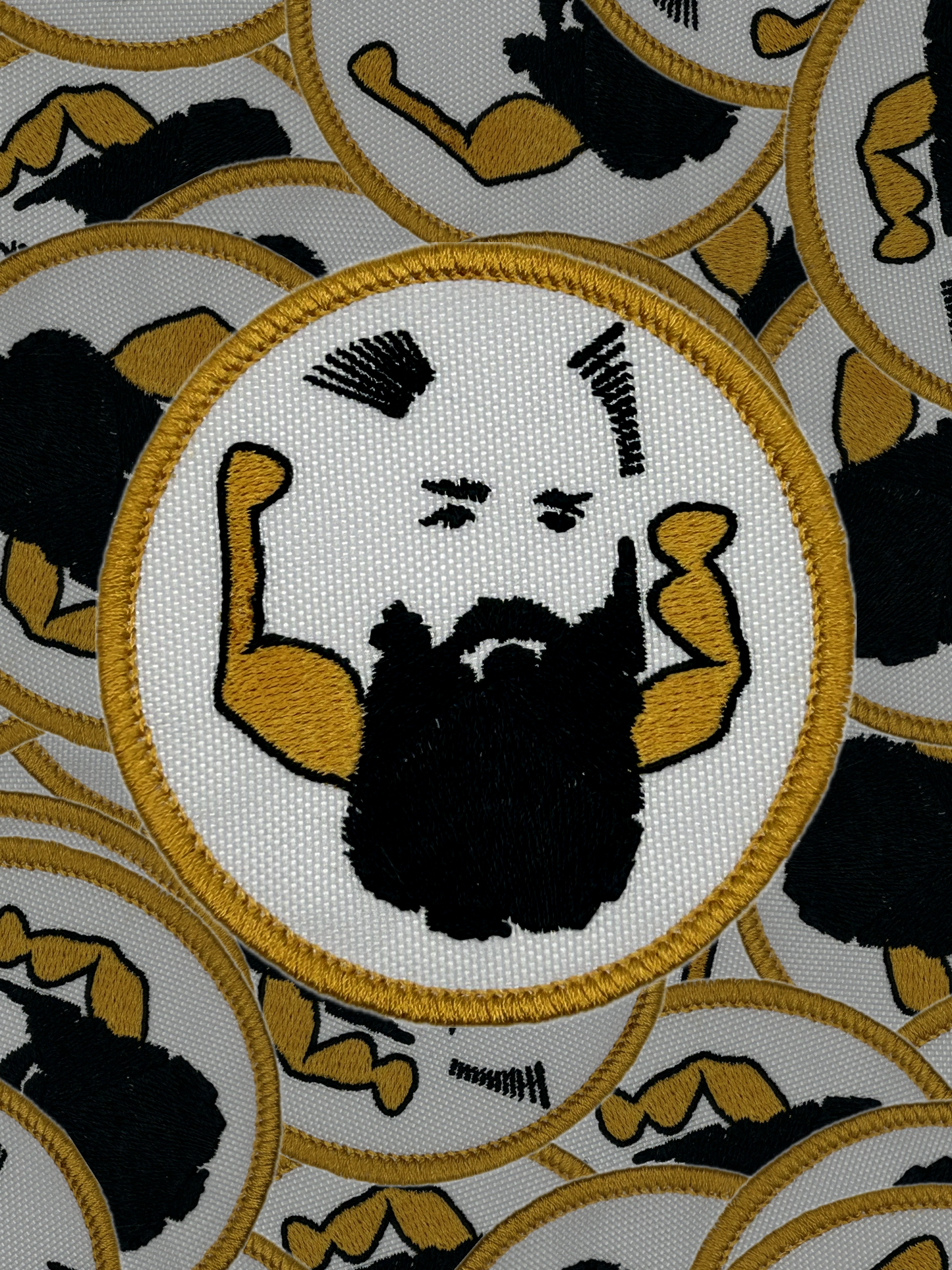 Patch with a stylized face and arms flexing, surrounded by similar patches on a white background.