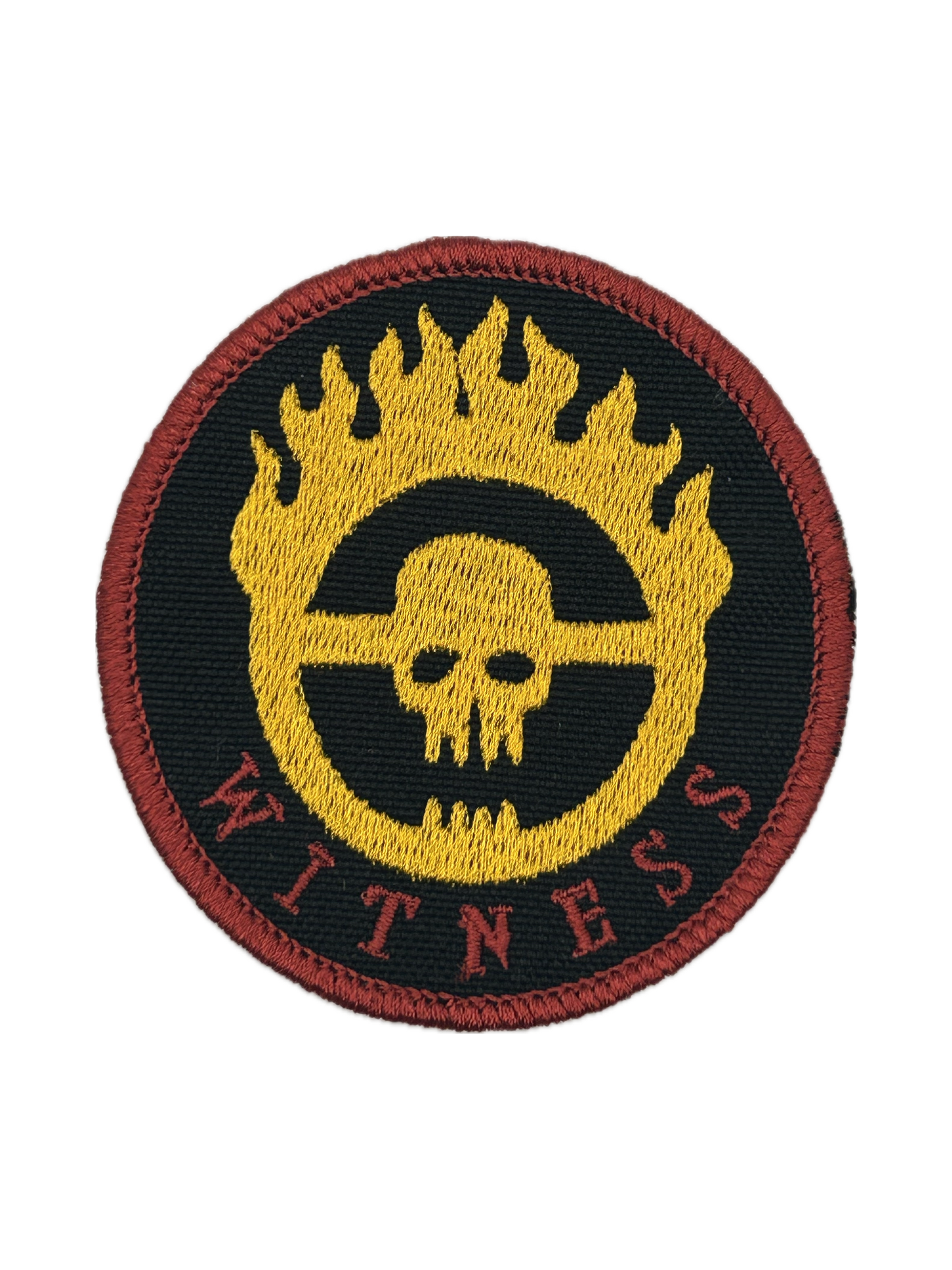 Round patch with skull design and 'Witness' text on a black background