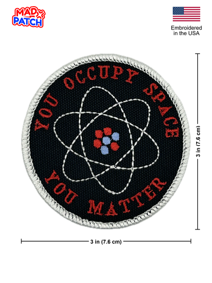 Round patch with 'Occupy Space You Matter' text and atom symbol, embroidered in the USA, on a white background.