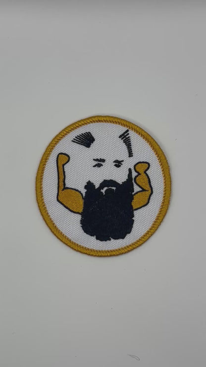 Circular patch with a stylized face and arms on a white background